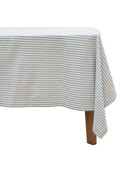 Light blue striped tablecloth on a round table 