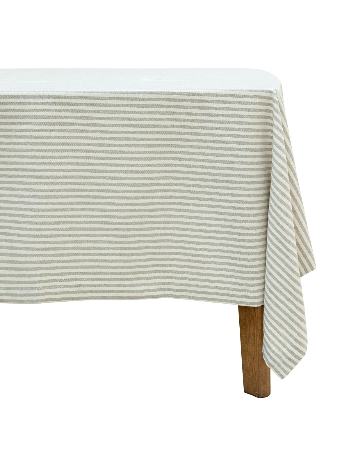 Light green striped tablecloth on a wooden table 