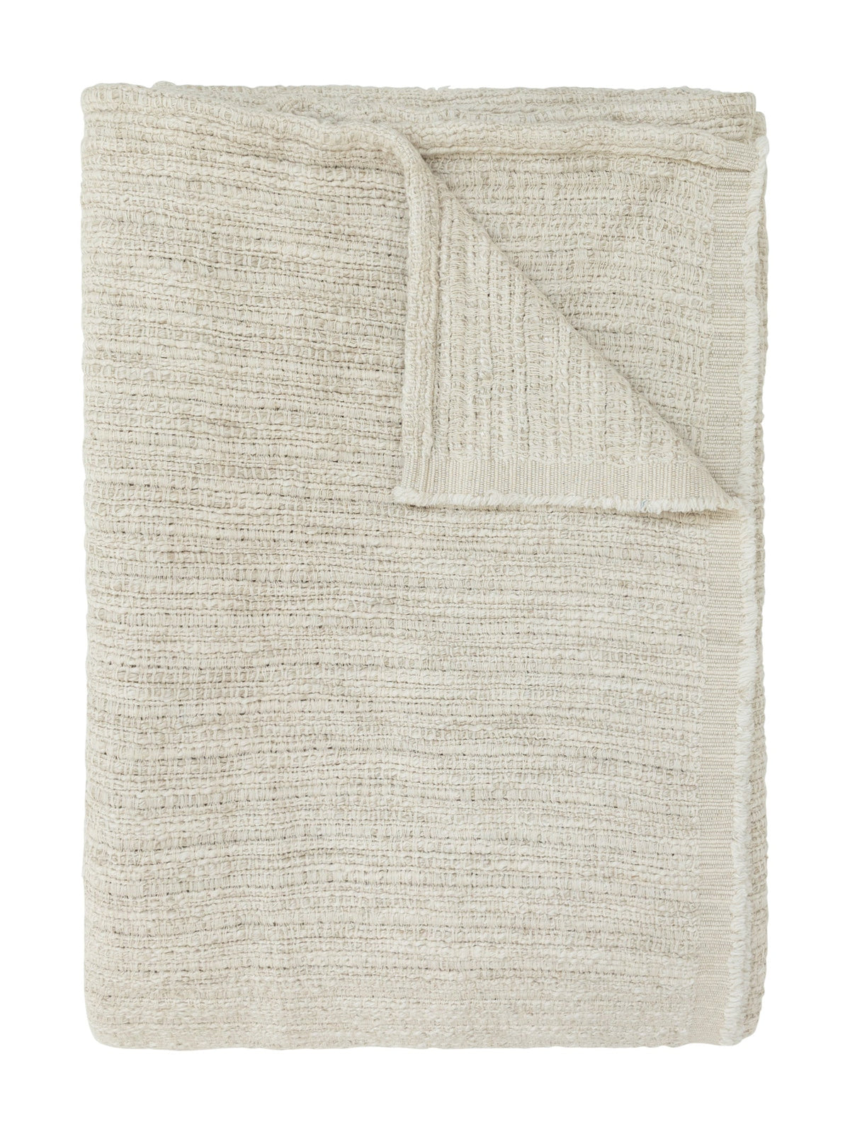 A folded textured throw blanket in a warm off-white or cream color