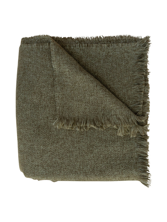 Green blanket with frayed edges