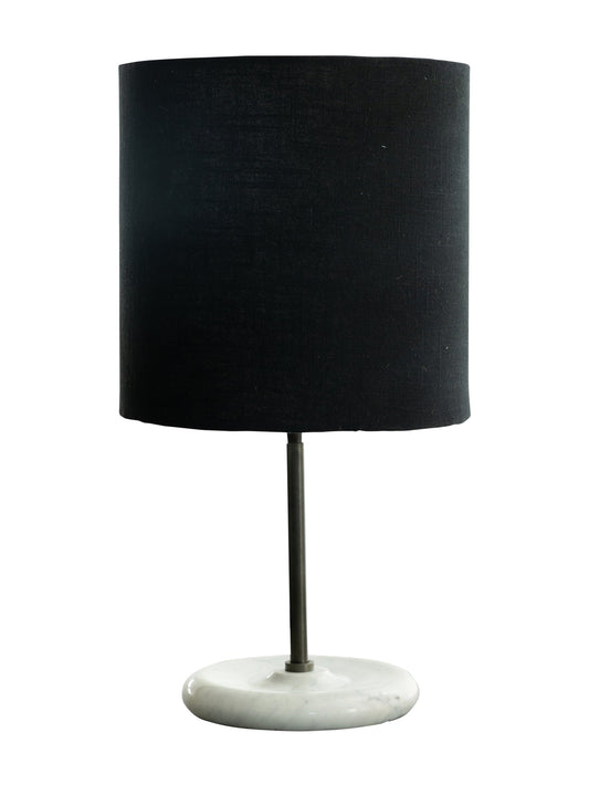 Table lamp with low-set iron stand, oversized linen fabric shade and marble base.