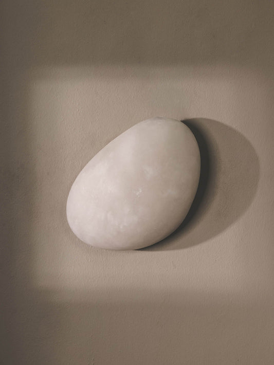 Handmade, sculptural alabaster wall light.