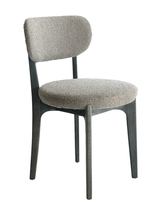 A gray upholstered Viola Oak dining chair with a solid oak wood frame and ergonomically curved backrest.